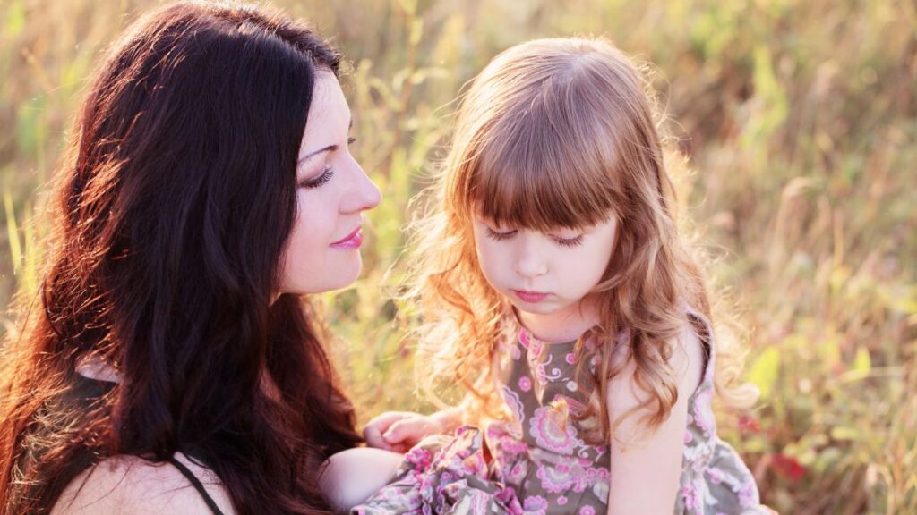 mom and daughter sitting outside