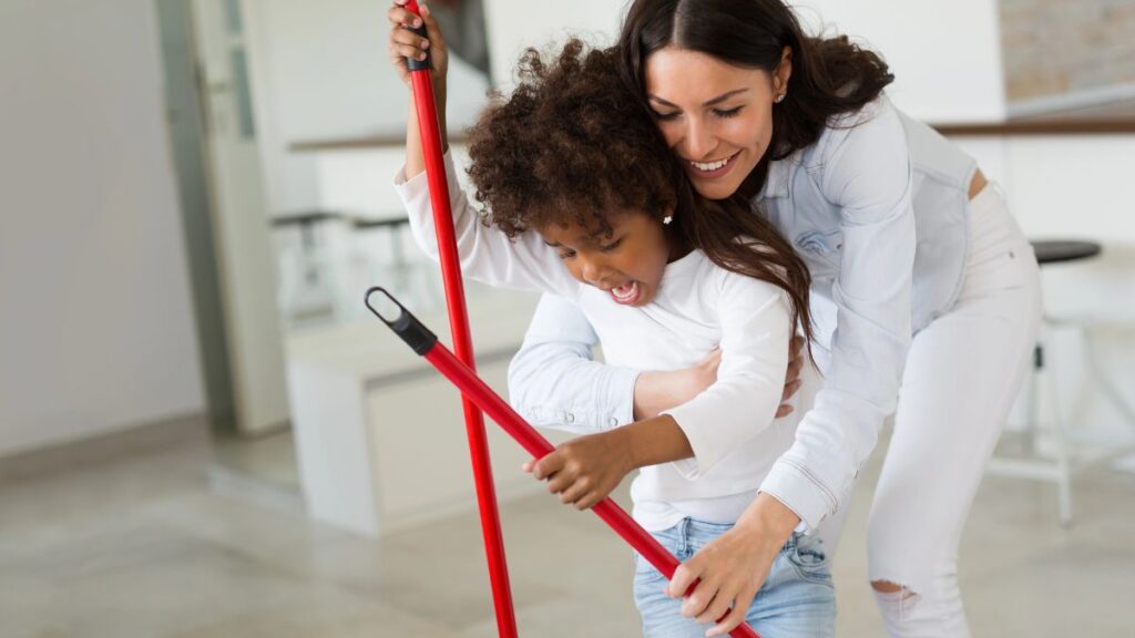 mother and daughter sweeping