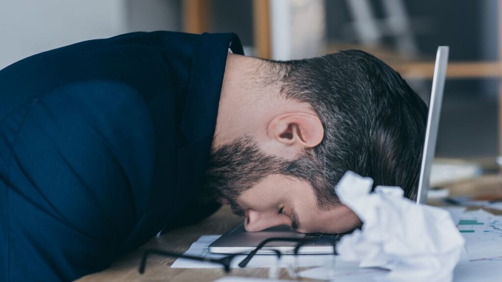 tried and frustrated man supset and sleeping at computer