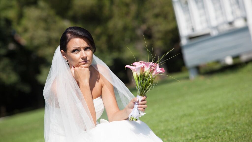 unhappy bride sitting outside