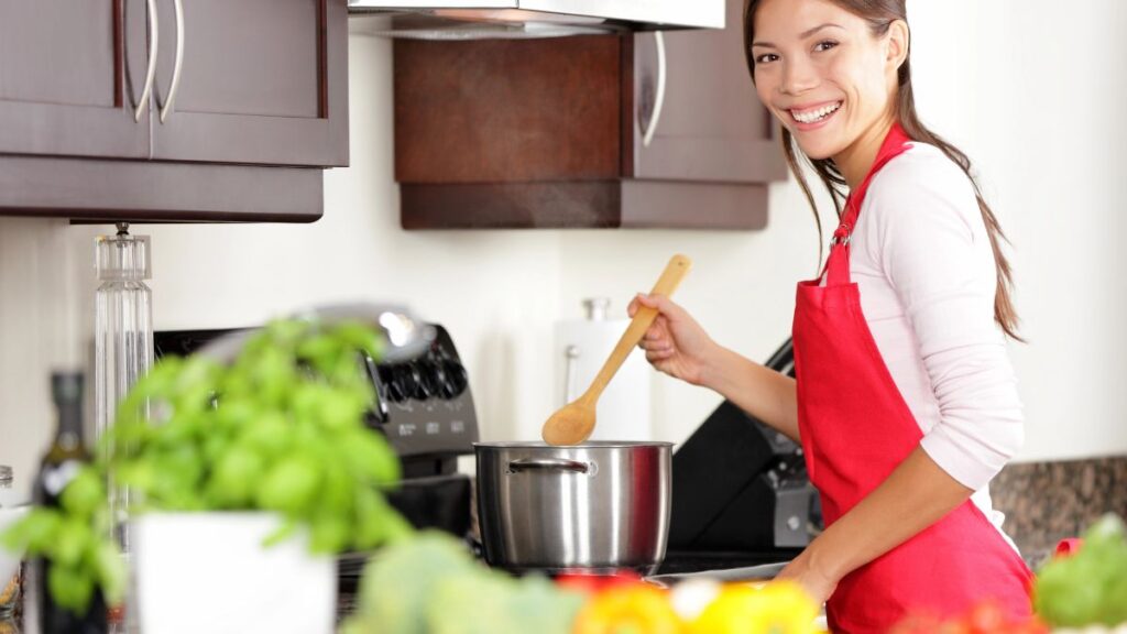 woman cooking on stovetop