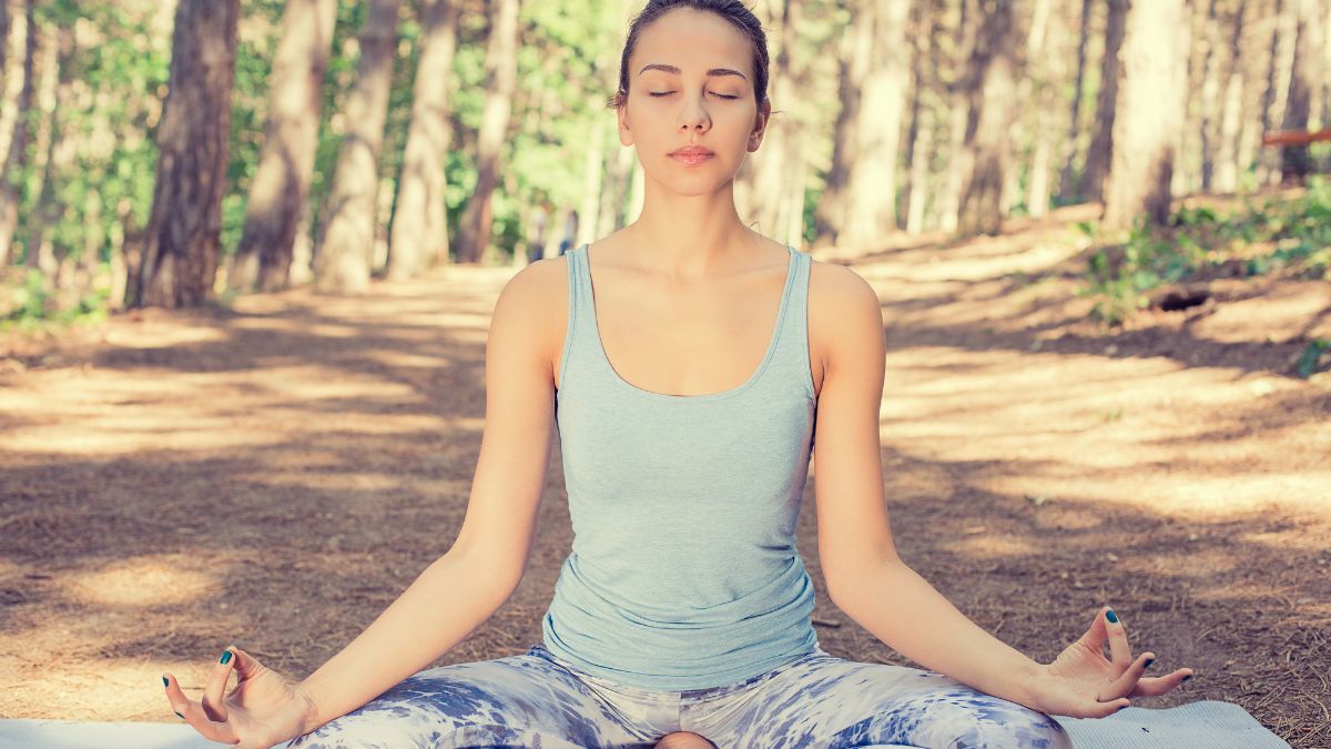 woman doing meditation outside