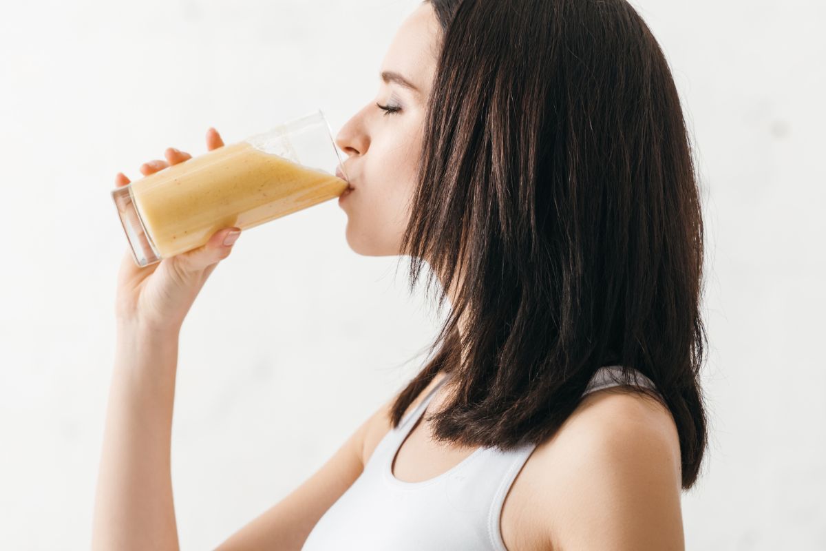 woman drinking a smoothie