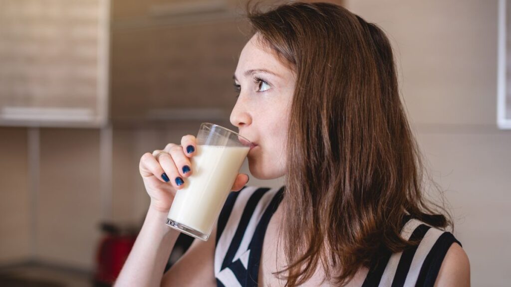 woman drinking oat milk