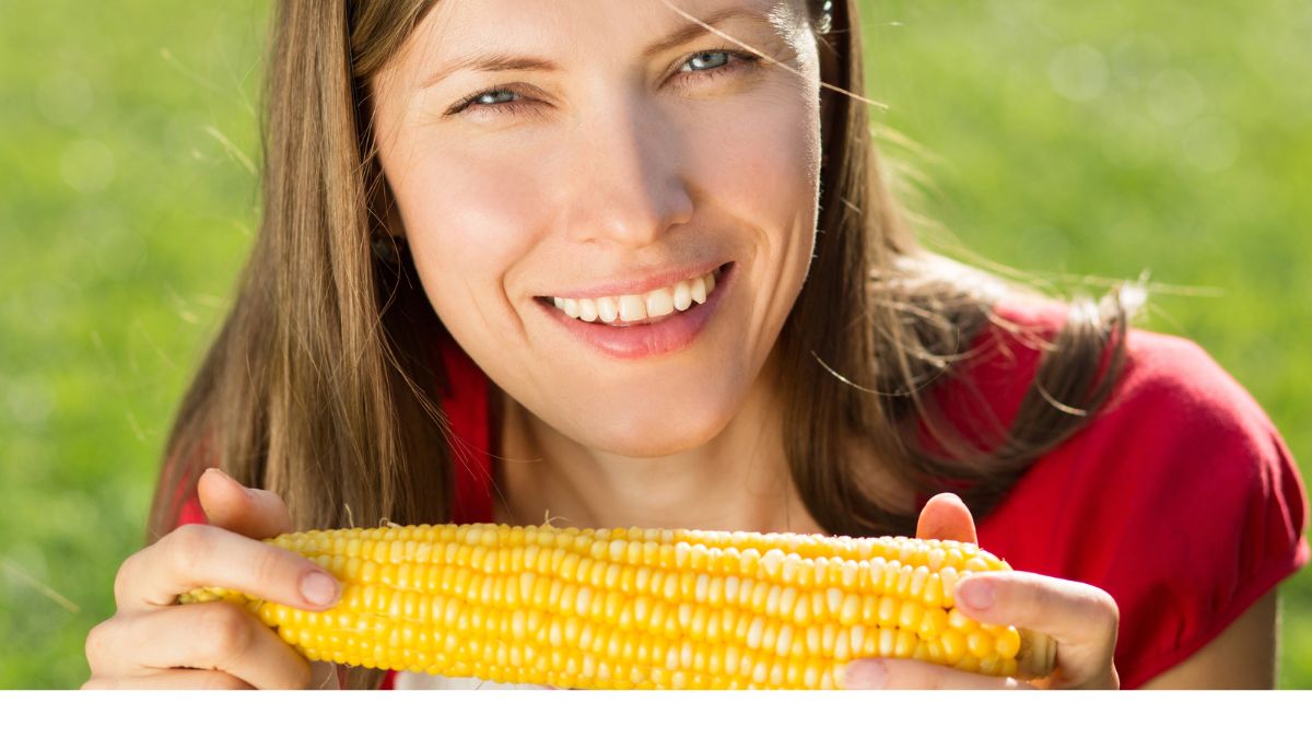 woman eating corn