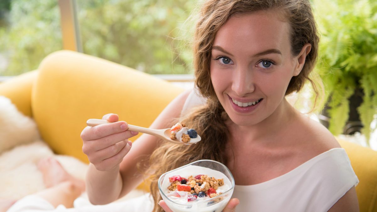 woman eating greek yogurt