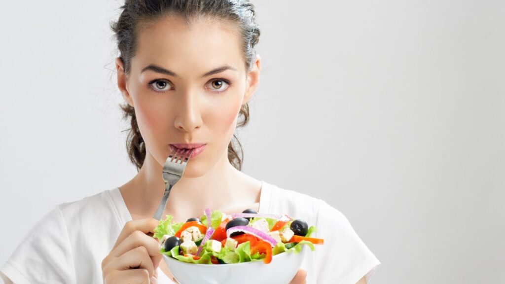 woman eating salad