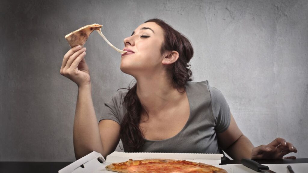 woman enjoying pizza