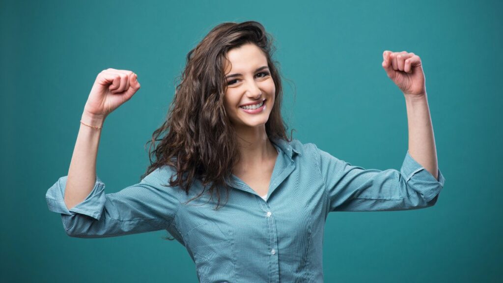 woman looking strong with arms flexed