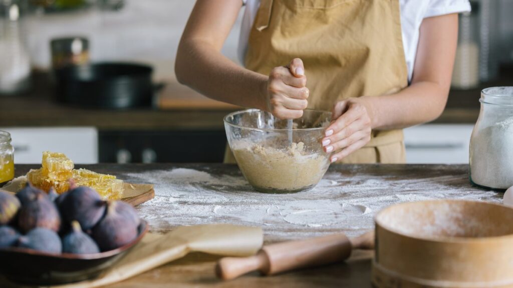 woman mixing dough