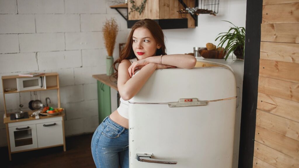 woman standing in fridge