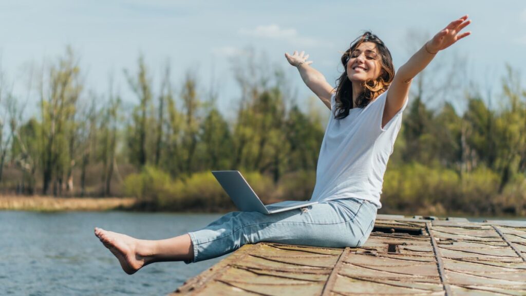 woman working outside with computer