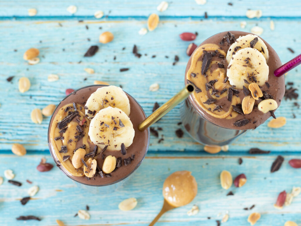 Chocolate peanut butter banana smoothie in two glasses