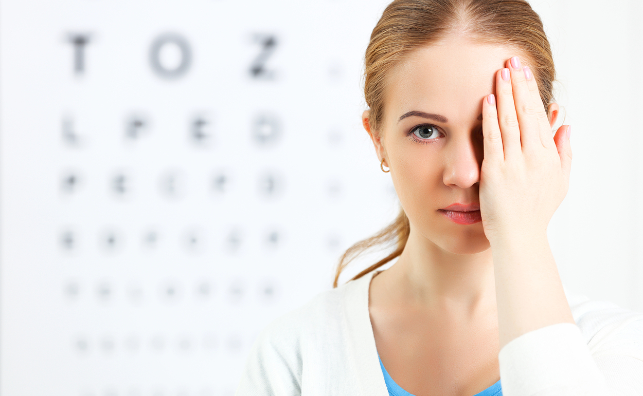 Eyesight check. woman at doctor ophthalmologist optician