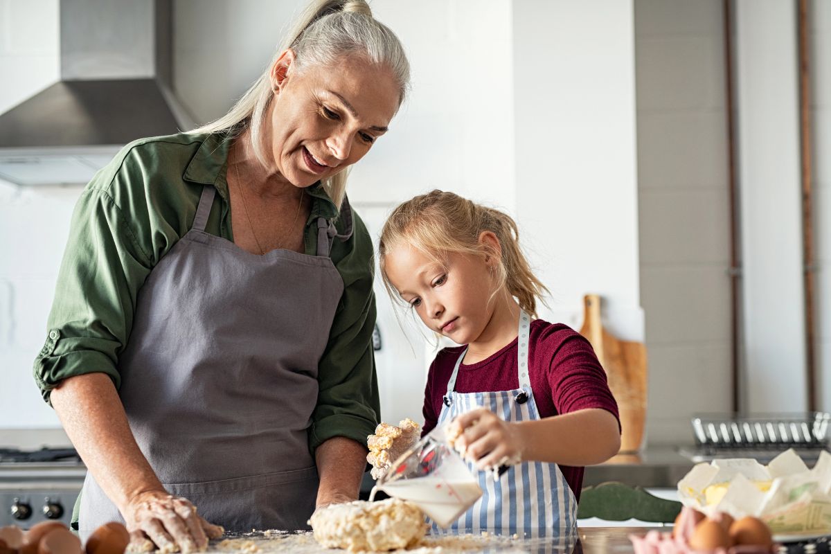 Grandma baking with her grandchild