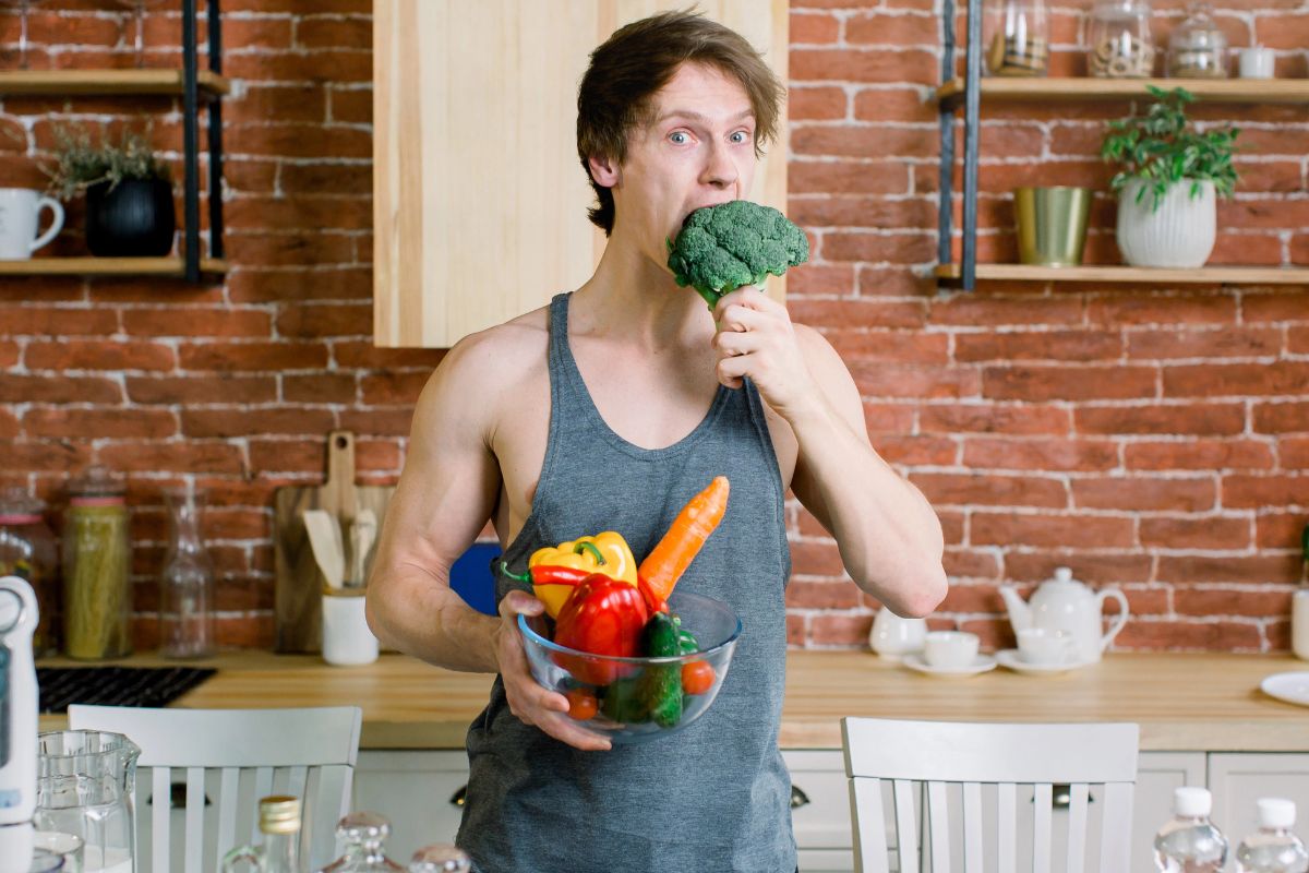 Man eating broccoli