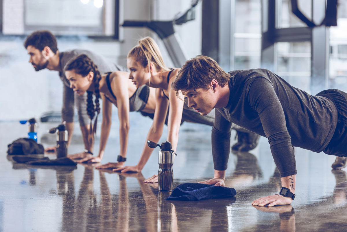 Sporty people exercising in gym