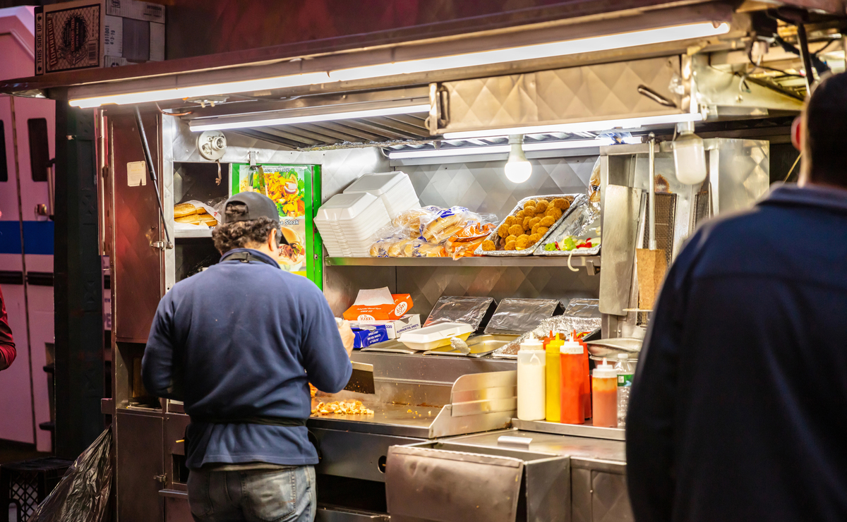 New York, Broadway at night. Take away fast food kiosks