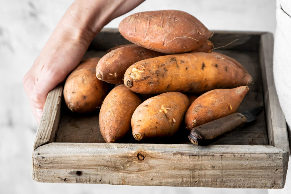 Sweet potatoes in wooden box