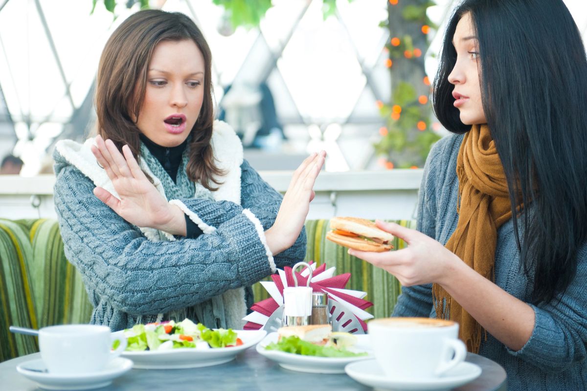 Two women debating over food