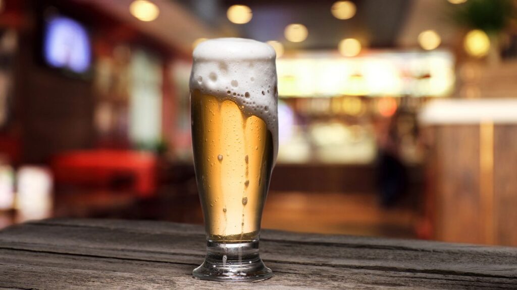 beer overflowing on bar