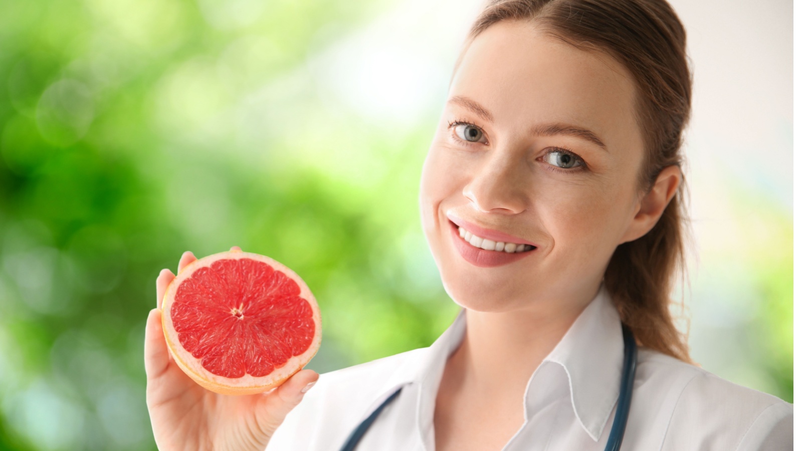 cardiologist doctor holding grapefruit