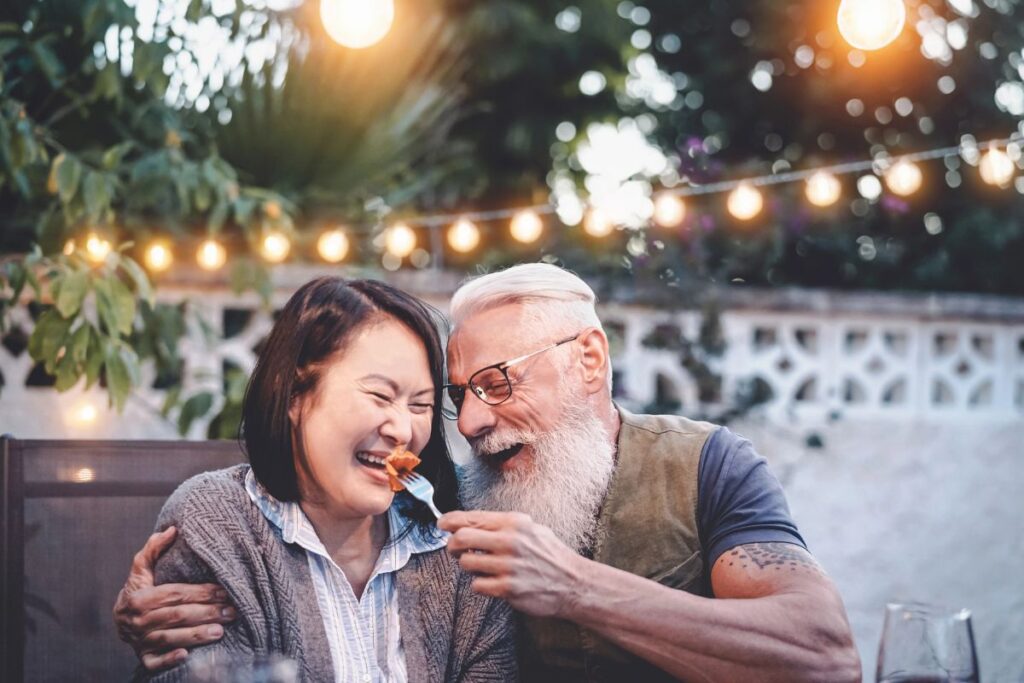 couple laughing and eating