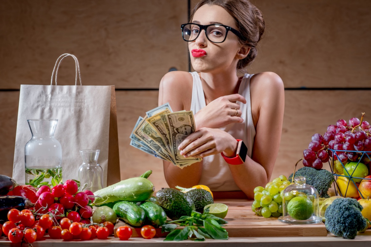 expensive vegetables woman with money