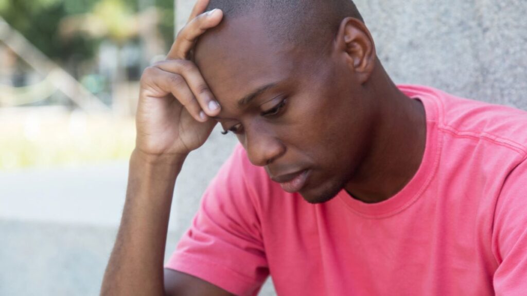 frustrated man with hand on head