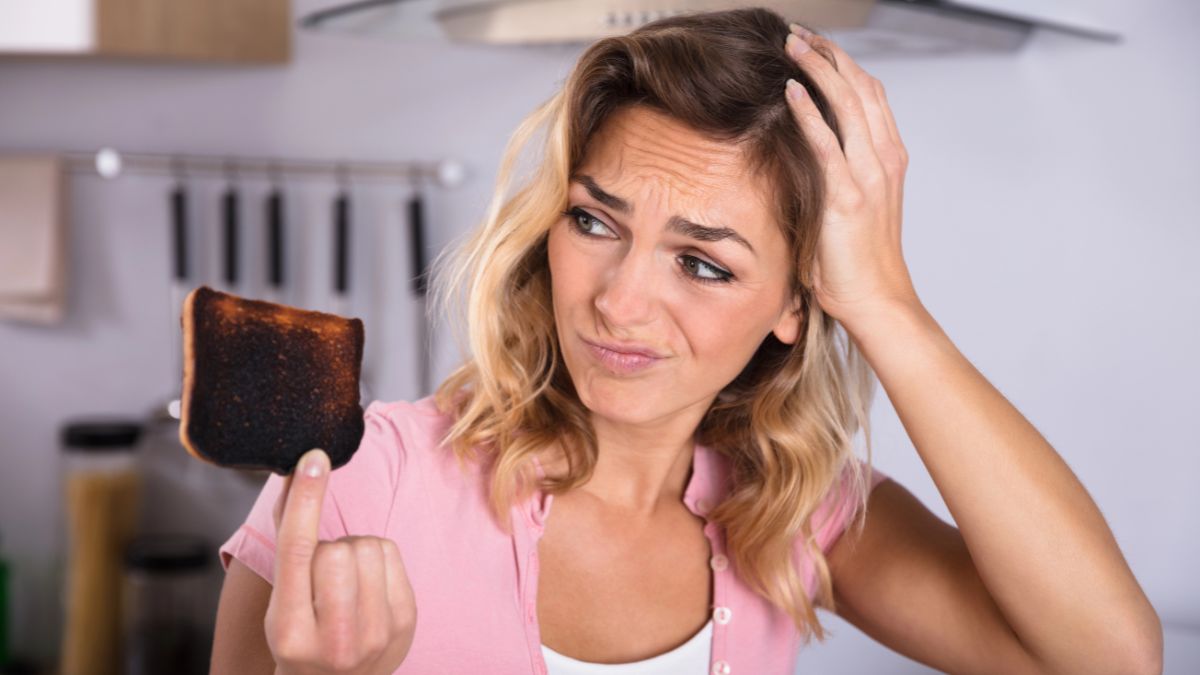 frustrated woman with burnt bread