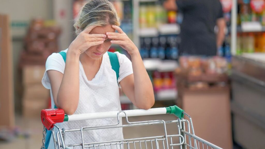 frustrated woman with shopping cart