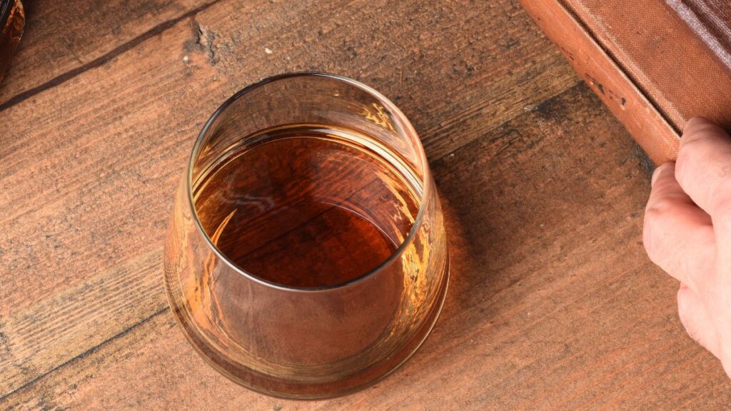 glass of bourbon on table