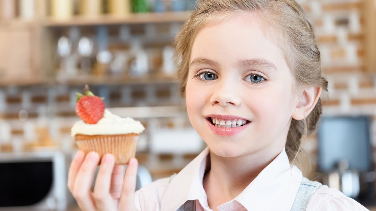 little girl with cupcake