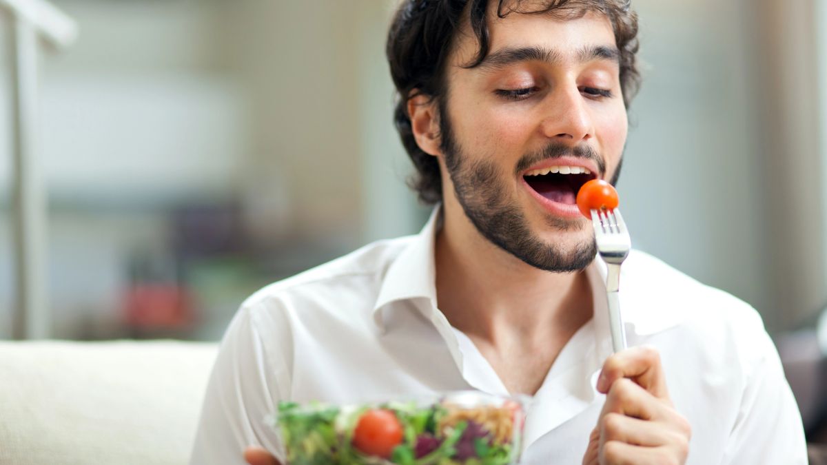 man eating salad