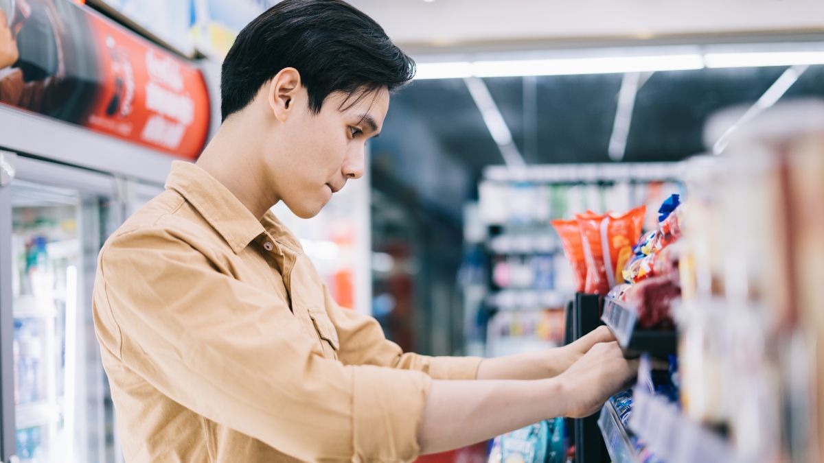 man looking frustrated in grocery store