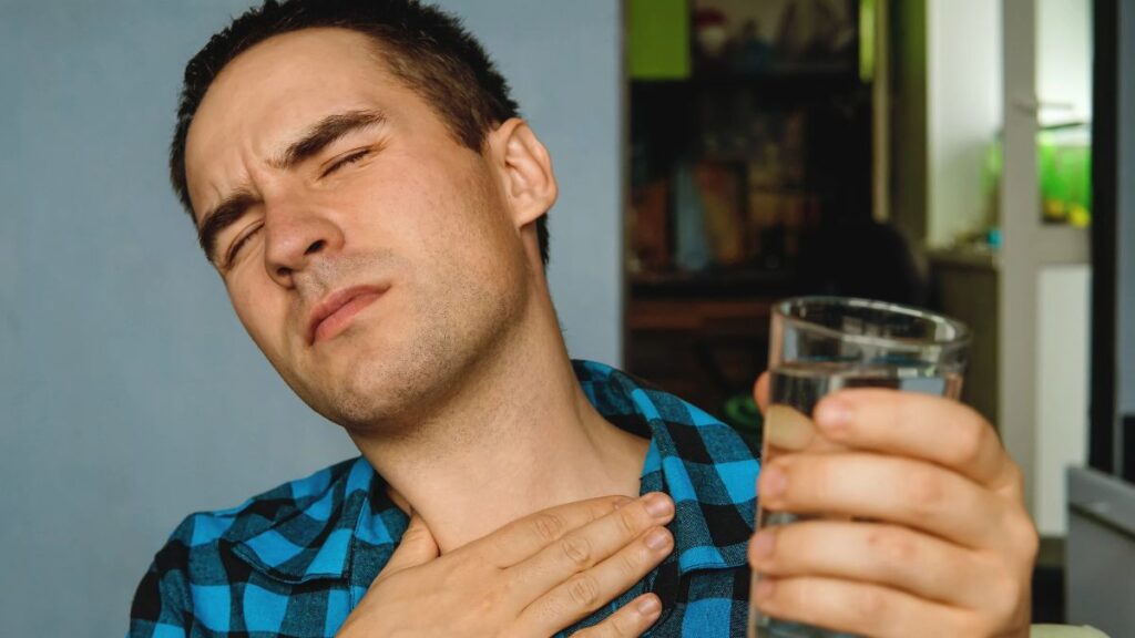 man with dry throat and water