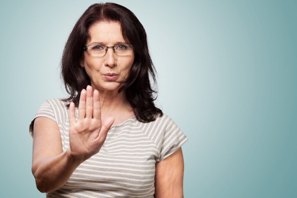 mature woman saying no hand up