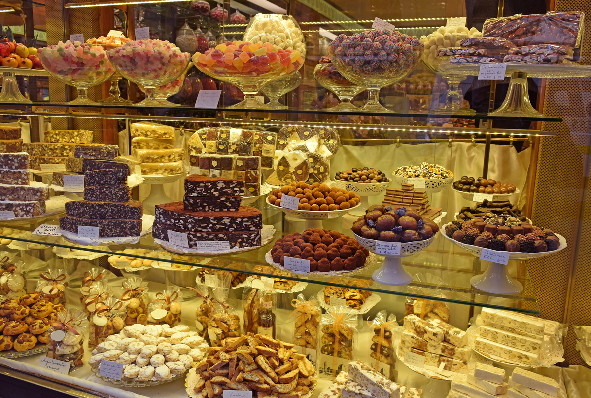 Pastry shop display window with sweets