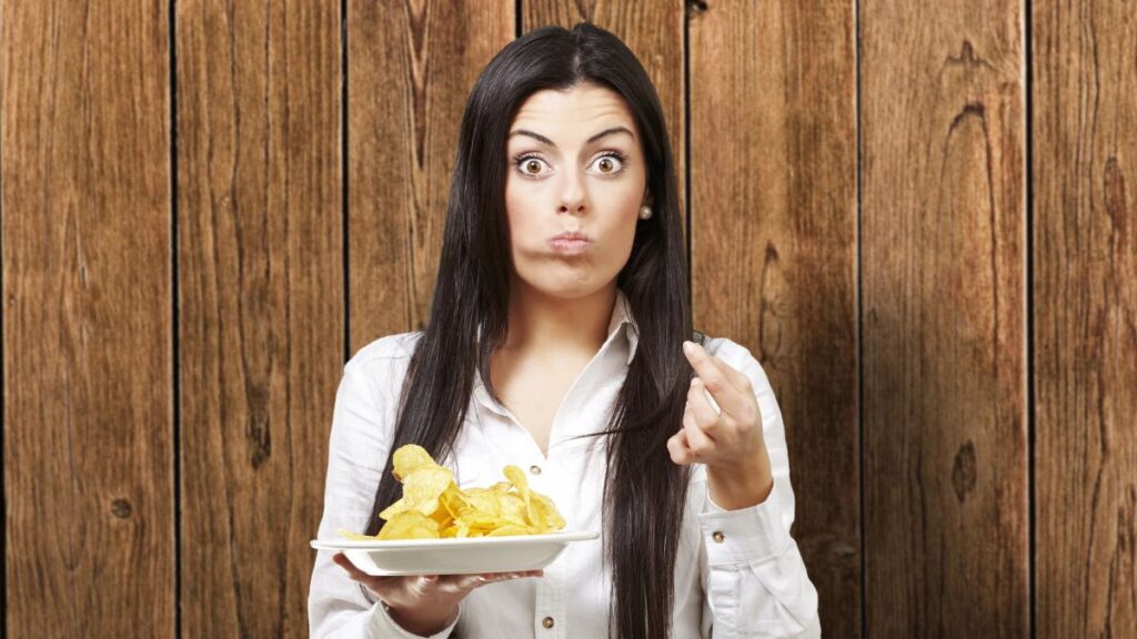 surprised woman eating chips