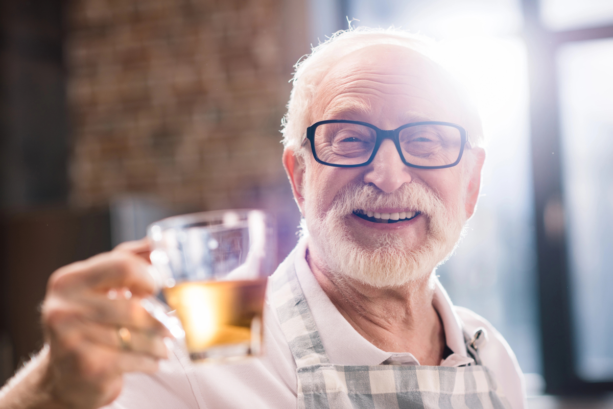 Senior man with cup of tea