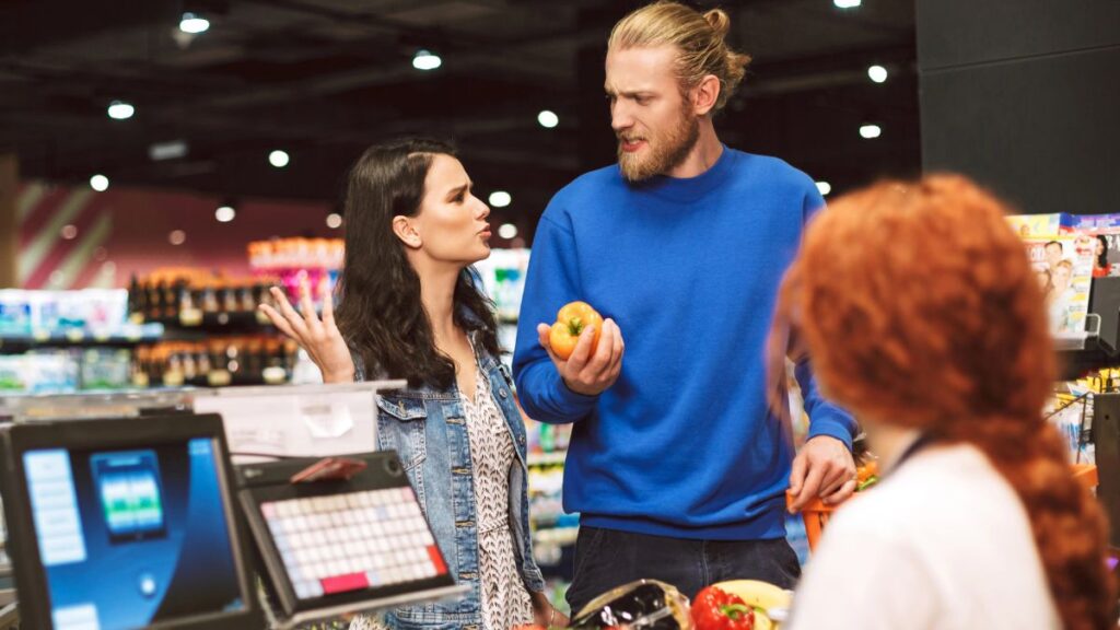 upset couple in grocery store