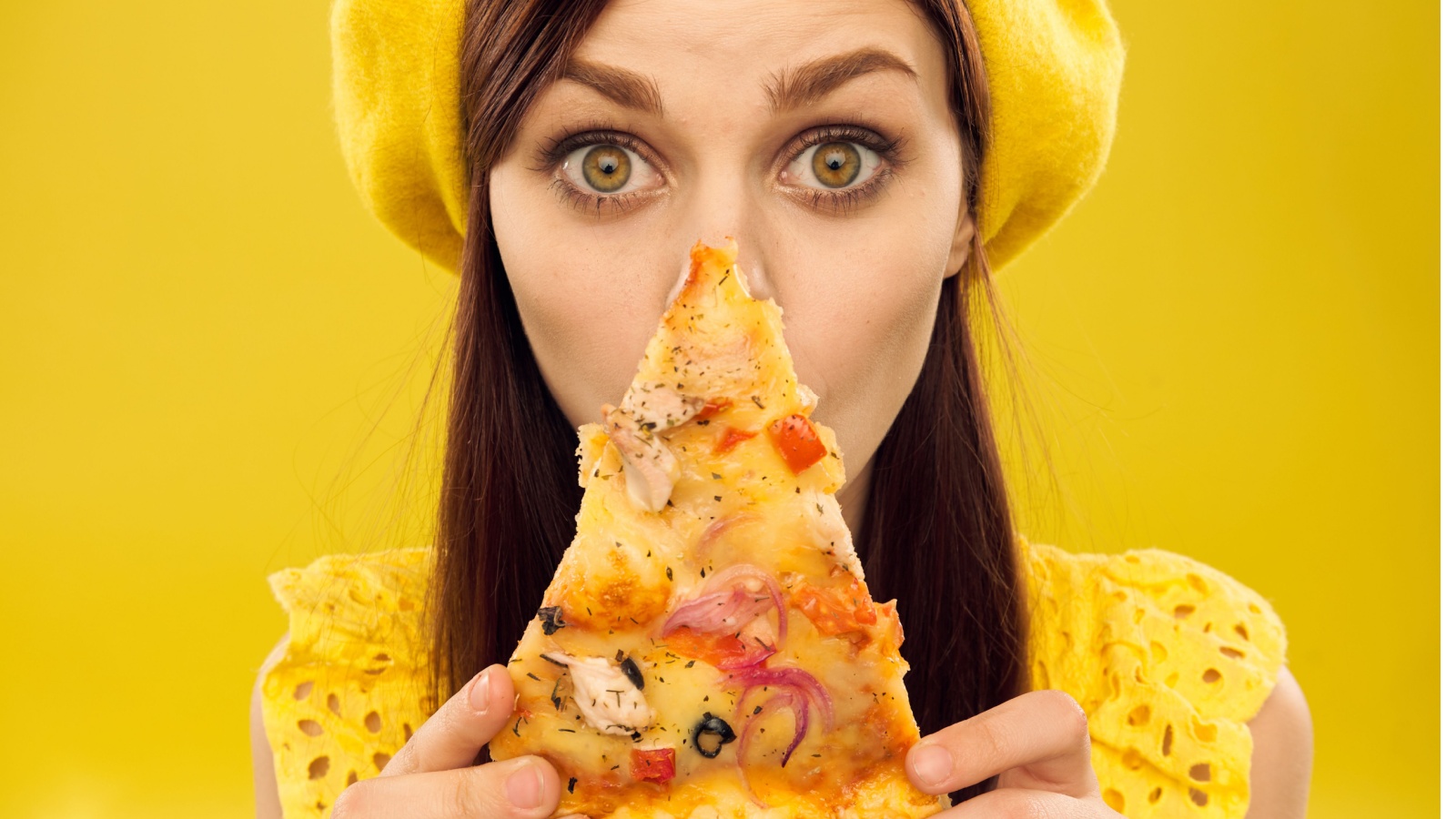 woman big eyed with pizza