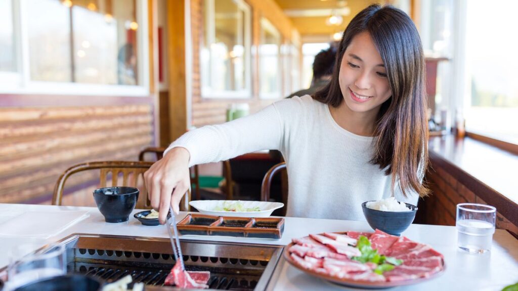 woman cooking korean bbq