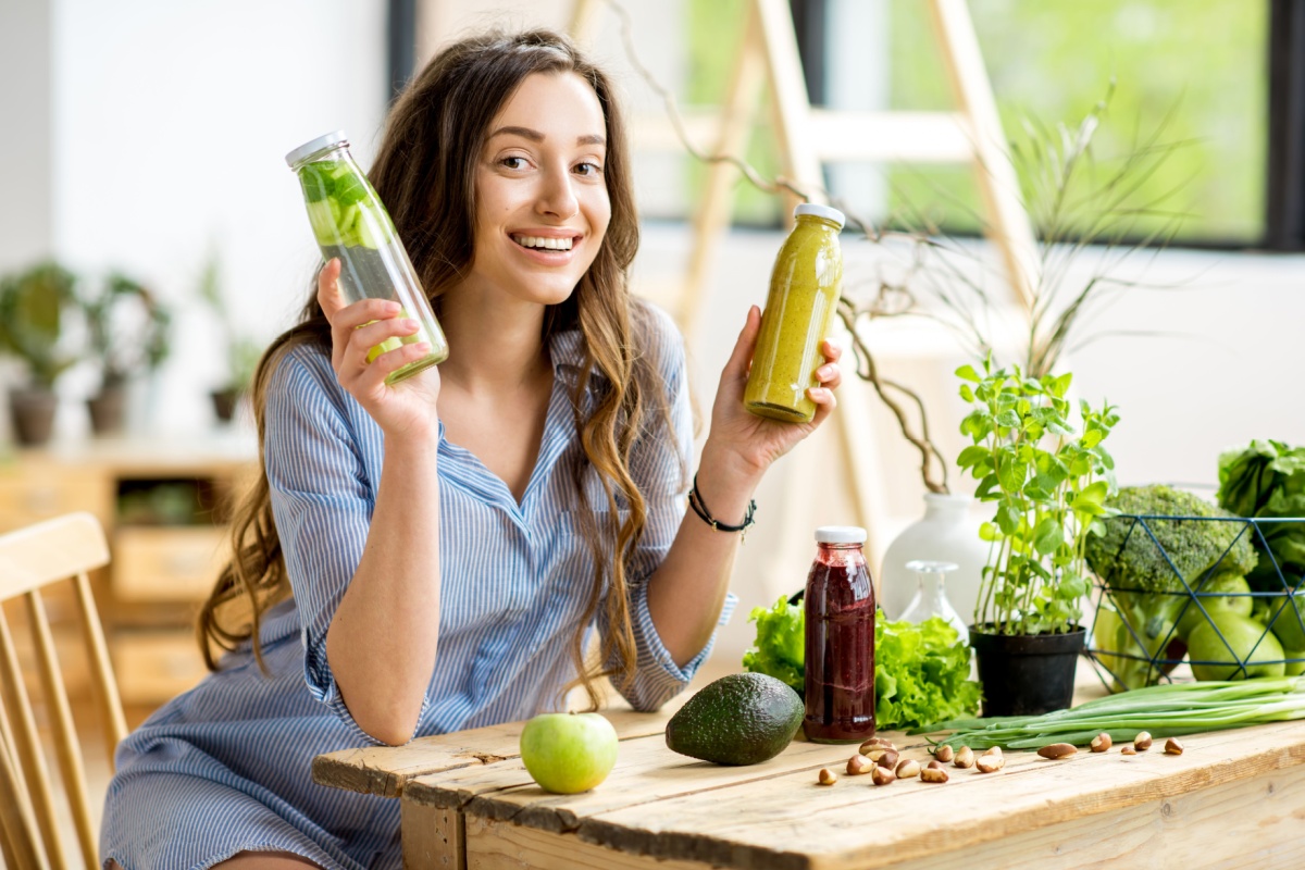 woman holding healthy water and juice