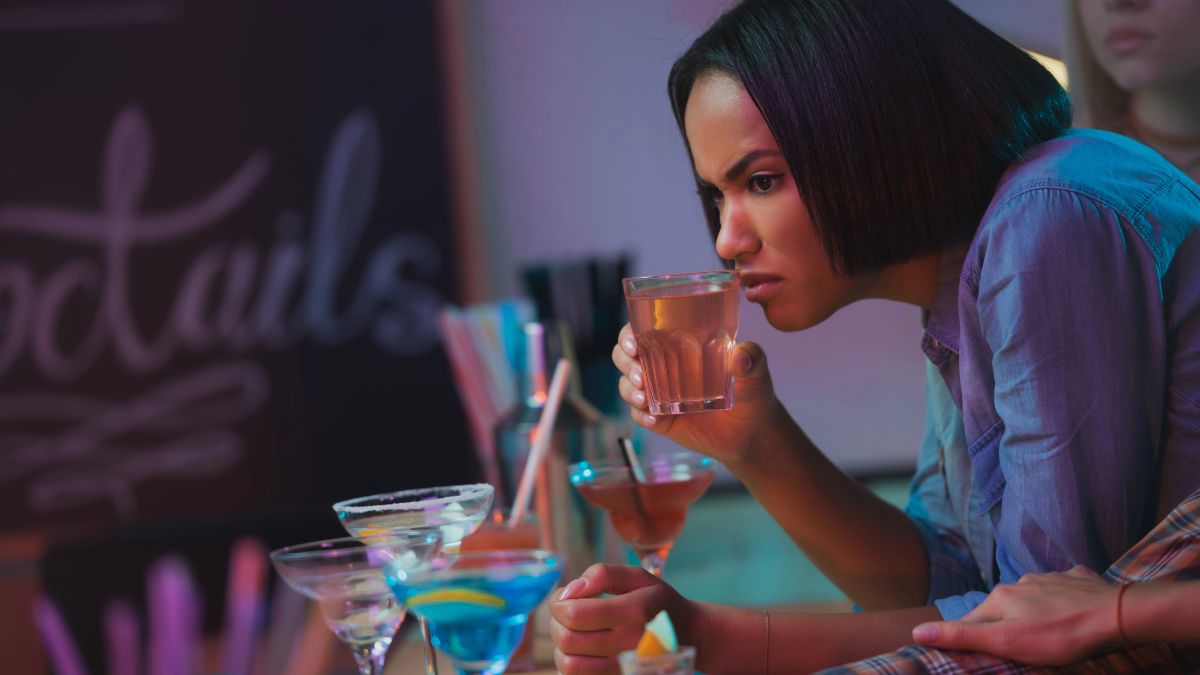 woman smelling beer