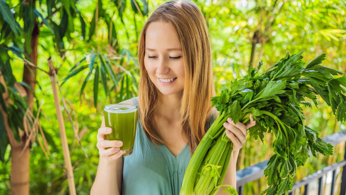 woman smiling with celery juice