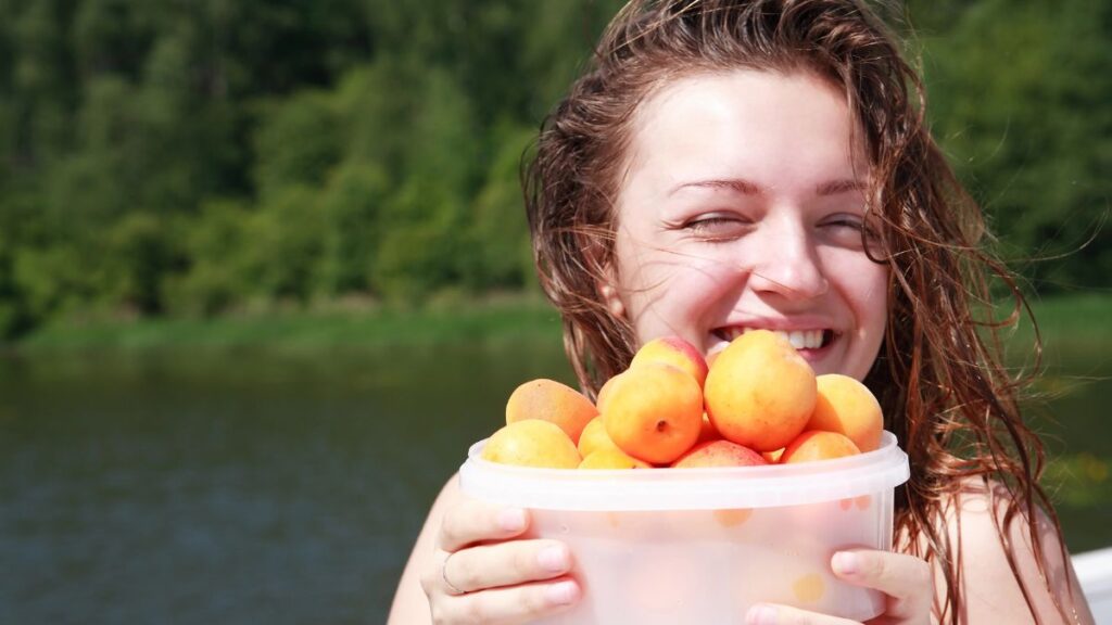 woman with apricots