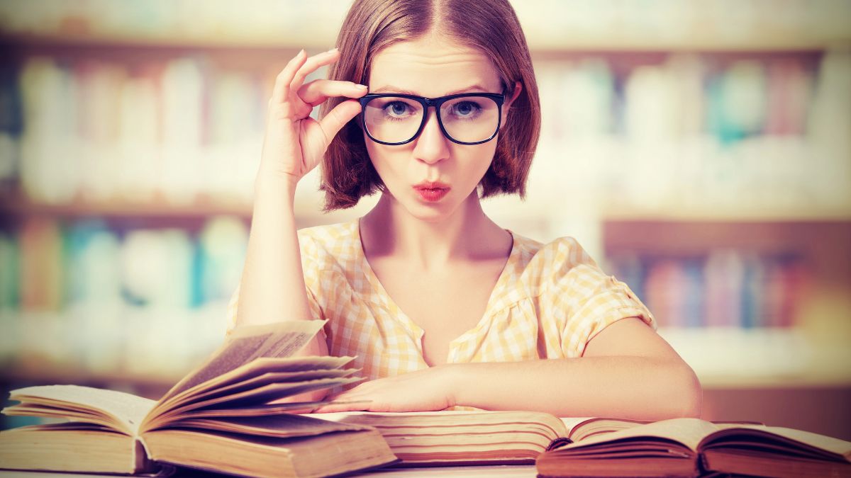 woman with glasses and book