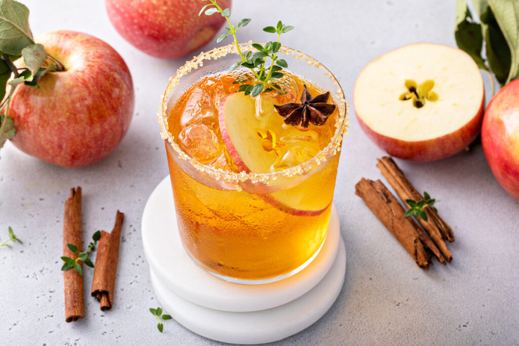 Apple cider margarita with brown sugar rim, cinnamon and fresh thyme, fall cocktail or mocktail idea