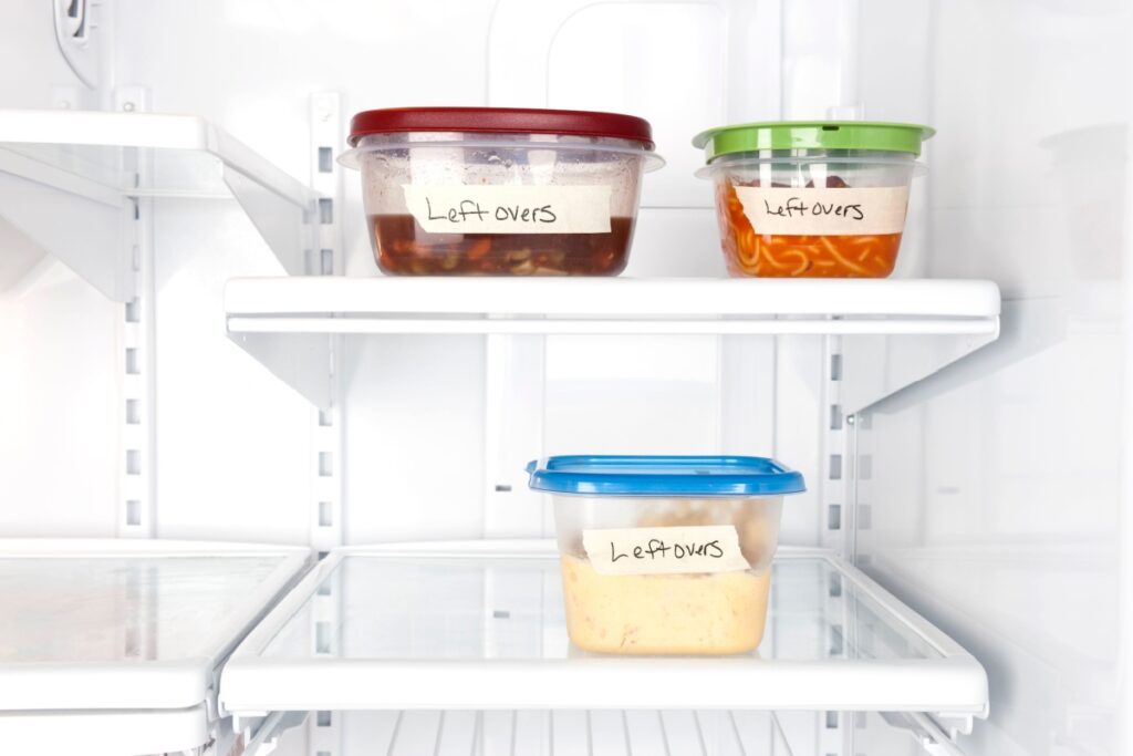 Leftover containers of food in a refrigerator